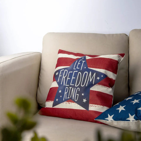 Patriotic 18x18 Inch Throw Pillow Covers Set Of 4 For Fourth Of July Independence Day American Flag Stars And Stripes Cushion Covers For Sofa Couch Bed Outdoor Home Decor with 'Let Freedom Ring' design on a beige couch.