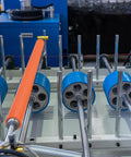 2 Pack 2 Inch Diameter 20 Inch Long Rubber Coated Conveyor Rollers Galvanized Steel Heavy Duty Transfer Cylinders For Kayak Loading Woodworking Jigs And Workshop Stands Real Deal Smooth Roll Orange Color displayed on conveyor system.