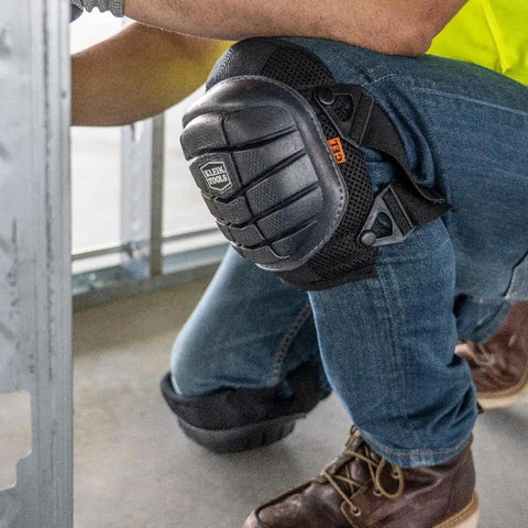 Worker wearing Lightweight Gel Knee Pads With Slip Resistant Caps And Adjustable Straps For Construction Work On The Job