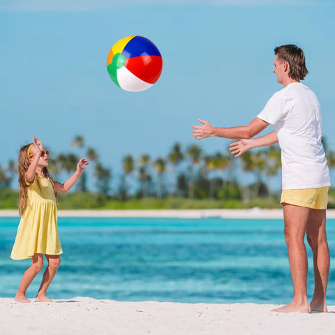 Man and child playing with inflatable beach ball by the ocean, part of Inflatable Beach Balls And Neon Sunglasses Set For Pool Party Favors 48 Pack Includes 24 Beach Balls And 24 Sunglasses Adults Summer Water Fun Toys Beach Park Backyard Party Supplies