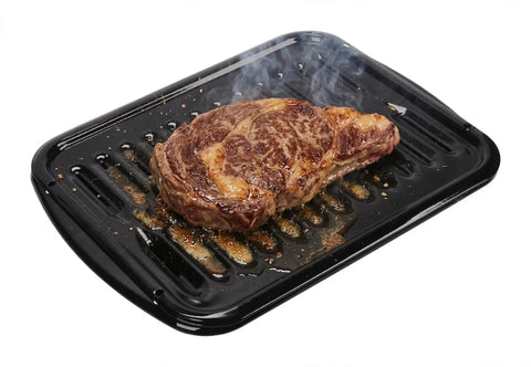 Steak on Genuine OEM Top Notch Premium Broiler Pan Replacement 4396923 for Electric and Gas Ovens, showing searing effect.