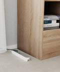 Slick Black Smart Power Strip With WiFi App Control, Heavy Duty Surge Protector, Built In USB Charging Ports, Total Game Changer For Your Home Office Or Gaming Rig Setup beside a wooden shelf.