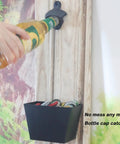 Hefty Black Cast Iron Wall Mounted Beer Bottle Opener With Spacious Cap Catcher Bucket Keeps Your Home Bar Or Man Cave Slick And Mess Free Includes Mounting Hardware in use with beer bottle.