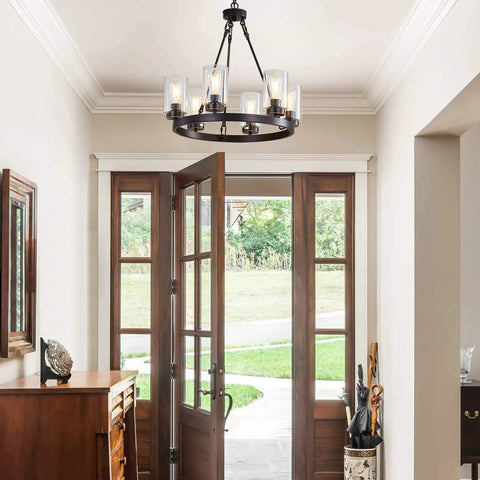 Six Light Industrial Rustic Farmhouse Wagon Wheel Chandelier In Black Metal With Clear Glass Shades in entryway
