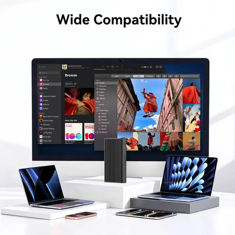 Blazing Fast 40Gbps NVMe M2 SSD Enclosure Handles Up To 8TB with sleek design next to laptops and a monitor in a modern workspace.