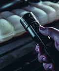 Person holding Stinger High Output LED Duty Flashlight With Piggyback Charging Kit 2000 Lumen 25000 Candela Long Range Beam