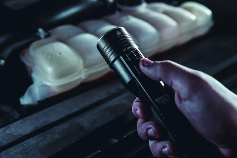 Person holding Stinger High Output LED Duty Flashlight With Piggyback Charging Kit 2000 Lumen 25000 Candela Long Range Beam