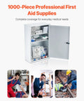 White metal three-shelf first aid cabinet with open door and visible medical supplies
