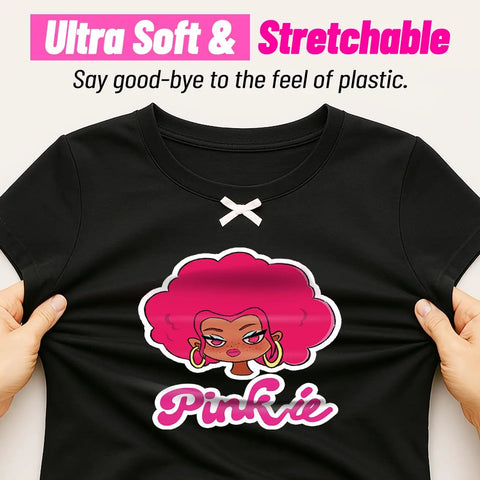 Hands stretching t-shirt with cartoon design, showcasing Dark Fabric Inkjet Heat Transfer Paper For Iron On T Shirts 10 Sheets 8.5x11.