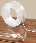 4 Ft Clear Corner Protectors For Babies, Soft Edge Guard Pad For Sharp Furniture, Heavy Duty Pvc Safety Tape For Cabinets And Tables, Zero Drama Baby Proofing That Is A Solid Pick, transparent PVC tape roll on wooden surface.