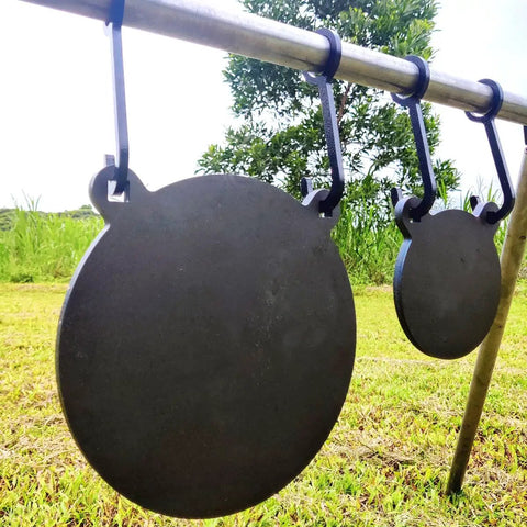 AR500 Steel Gong Target 3 Eighths Inch Thick For Precision Shooting hanging on a stand outdoors