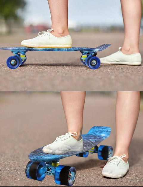 Person riding Complete Mini Cruiser Skateboard For Kids And Beginners 22 Inch Starry Sky Retro Deck with smooth wheels on pavement.