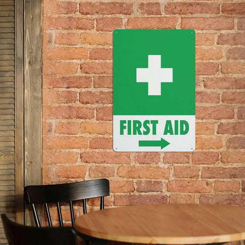 Right Arrow Green First Aid Sign 8x12 Inches Weatherproof Reflective Aluminum Plate on brick wall