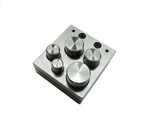 Six Piece Disc Cutter Set With High Carbon Steel Punches And Cutter Block Hammer Operated for cutting precise discs from sheet metal.