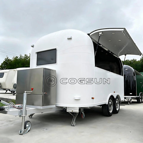Premium Fully Equipped Food Trailer With Complete Mobile Kitchen Setup Designed For Street Vendors And Festival Catering A Ready To Roll Turnkey Business Rig Built For Serious Hustle, showing white exterior and stainless steel storage.