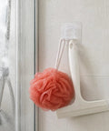 Sick Wall Mount Hooks, Totally Rust Proof Storage Rack For Coats, Bags, And Picture Hanging, Rad Home Organization Gear holding a shower squeegee and a loofah.