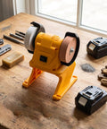 Top Shelf Mini Bench Grinder With 18V Compatible Battery For Precision Sharpening And Metal Polishing on wooden workbench.