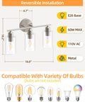 Three Light Bathroom Vanity Light Fixture In Brushed Nickel With Clear Glass Shades Over Mirror Wall Sconce dimensions guide