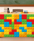 Six Foot Building Block Table Skirt With Bold Primary Bricks For Teacher Desk And Classroom Tables covering a desk with colorful brick design.