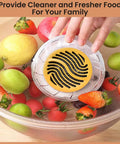 Cordless Electric Produce Washer And Veggie Scrubber Driven By Smart Electrolytic Tech And Heavy Duty Titanium Rods For A Legit Deep Clean On Fresh Fruit Rice And Cookware Daily cleaning fruits in a bowl.