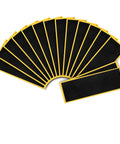 15Pcs Fingerboard Foam Grip Tape Set With Self Adhesive Anti Slip Black 4.33x1.5Inch arranged in a fan shape on white background