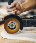 Dead On Tough 2Pcs Angle Grinder Flange Locking Nuts 5/8 Inch 11 Thread in use, showing quick swap disc on a wood surface.