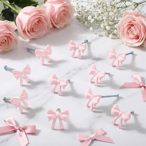 Upgraded 15 Pack Dope Pink Bow Knot Drawer Knobs With Full Screw Kit For Cabinet Hardware Makeovers And Bedroom Dresser Updates Solid Vibe For Your Ultimate Home Refresh Project with pink bows and screws on a marble surface.