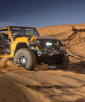 Hella Tough Heavy Duty Soft Shackles 57K Lbs Breaking Strength 1/2 X 22 Inch Polyethylene Synthetic Rigging With Protective Sleeves on Jeep in sand.