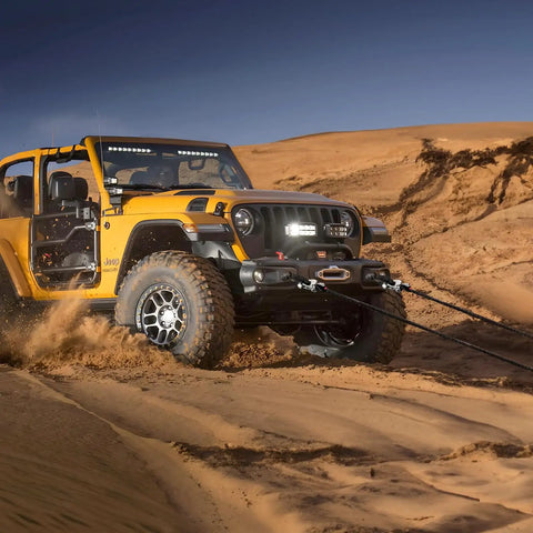 Hella Tough Heavy Duty Soft Shackles 57K Lbs Breaking Strength 1/2 X 22 Inch Polyethylene Synthetic Rigging With Protective Sleeves on Jeep in sand.