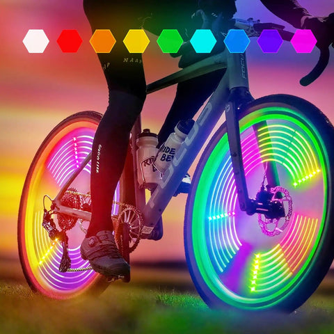 Cyclist using Three Pronged Bicycle Spoke Lights Set for Bike Wheels With 360 Degree Visibility LED Wheel Lights at sunset