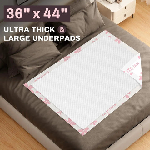 Top Shelf Extra Large Disposable Adult Bed Pads, 36 By 44 Inch Super Absorbent Underpads on bed for overnight protection.