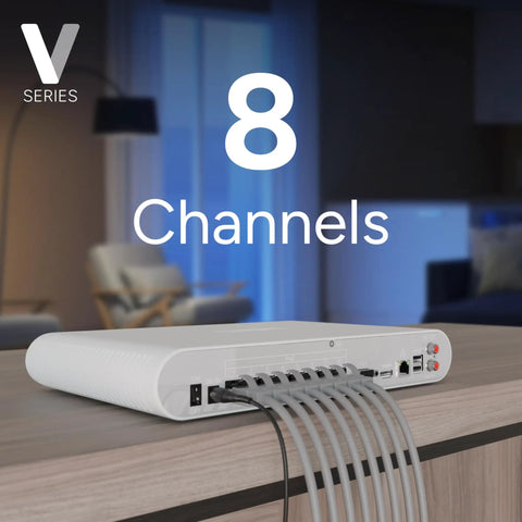 8 Channel 4K NVR System With 4 PoE Bullet Cameras V3 on a desk, showing connected cables in a modern living room setup.
