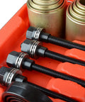 Close-up of 26 Piece Universal Bushing Press And Pull Sleeve Kit with sleeves and spindles for automotive repairs.
