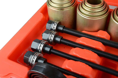 Close-up of 26 Piece Universal Bushing Press And Pull Sleeve Kit with sleeves and spindles for automotive repairs.