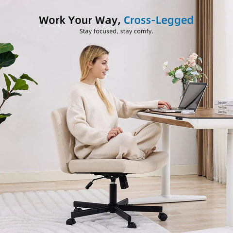 Woman sitting cross-legged on Criss Cross Desk Chair With Wheels, Wide Cross Legged Comfort For Home Office Or Vanity, beige upholstery.