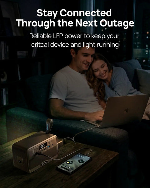 Couple using a Slick Pocket Sized Portable Power Station With Resilient LiFePO4 Cell And 100 Watt Output, charging devices.