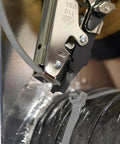 Close-up of HVAC Flex Duct Cable Tie Tensioning Tool with Auto Cut Off securing duct with nylon tie