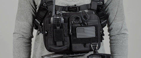 Close-up of 2-In-1 Convertible Chest Pack And Hydration Backpack with equipment, MOLLE webbing, and USA flag patch visible.