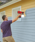 Cordless HVLP Paint Sprayer For Milwaukee 18v Battery Tool Only, 200w Brushless Motor handheld spray gun in action painting a house.