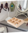 Six Compartment Wood Jewelry Tray With Multi Grid Layout For Rings And Bracelets Rustic Countertop Trinket Dish on a wooden surface.