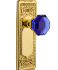 Egg And Dart Plate Waldorf Cobalt Door Knob Set In Polished Brass Finish For Privacy Doors With Two And Three Quarter Inch Backset Solid Forged Brass Plates And Lead Crystal Knobs showing ornate detail and cobalt knob
