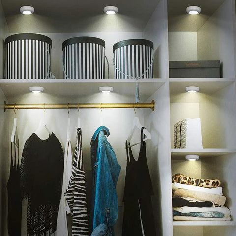 Closet illuminated by Six Pack Portable LED Puck Tap Lights Battery Operated Night Lights For Cabinets Closets Under Cabinet Lighting Kitchens Pantries And More Indoors And Outdoors Dope