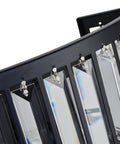 Close-up of Radiant K9 crystals on Modern Matte Black Flush Mount Wall Sconce with sleek design and metal frame.