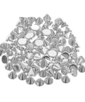 Pile of silver cone spike studs and round rivet disks for jackets