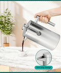 Premium French Press Coffee Maker With Built In Measurement Marks For Smooth Daily Brews Made From Safe Non Toxic Materials In Sleek Silver pouring coffee.