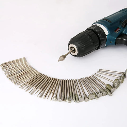 Side view of a stone carving diamond burr bit set, 50 pieces with 1/8 in shank, arranged beside a rotary drill