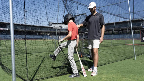 Backyard Baseball And Softball Batting Cage Net With Heavy Duty Vinyl Backstop And Pitcher Training Target in use on field