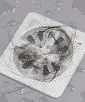 Image of a 20 Pack Disposable Shower And Kitchen Drain Hair Catchers Keep Your Pipes Snatched With Dope Anti Clog Mesh Guards covered in hair.