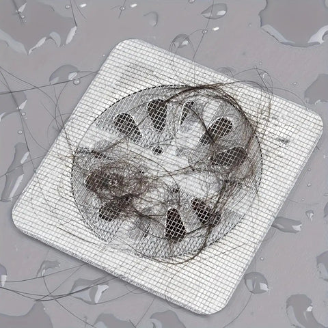 Image of a 20 Pack Disposable Shower And Kitchen Drain Hair Catchers Keep Your Pipes Snatched With Dope Anti Clog Mesh Guards covered in hair.