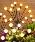 Outdoor Solar Firefly Lights 4 Pack With 32 LEDs Waterproof Pathway Lamps For Yard And Patio Solar Powered Garden Decor That Sways In The Breeze Bright Modern Night Lighting Awesome Gift For Women Moms Friends illuminating plants